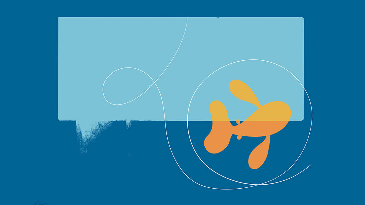 A fish swims in front of of a blue block